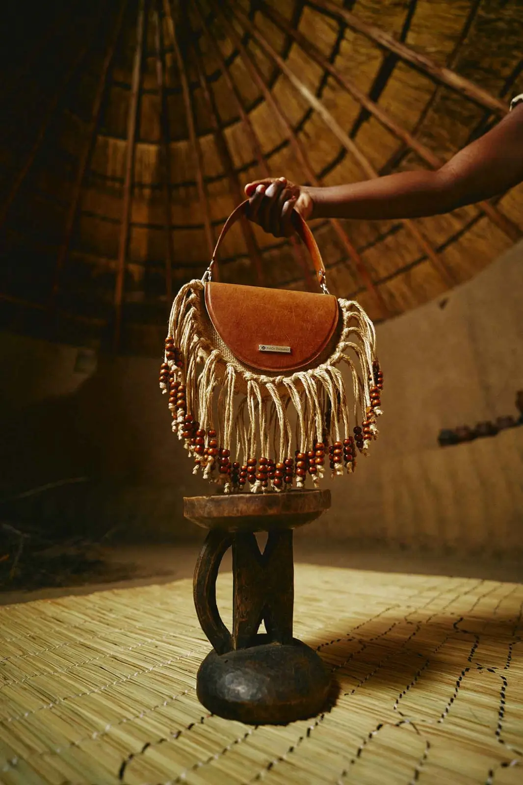 Mwedzi Purse held in warm natural light